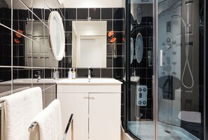 Shower, hair dryer, towels, soap
