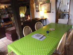 The huge dining room table seats 8 comfortably. It is next to the kitchen.