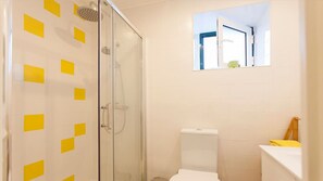 Shower, hair dryer, towels, shampoo