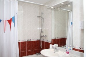 Combined shower/tub, hair dryer, towels, soap