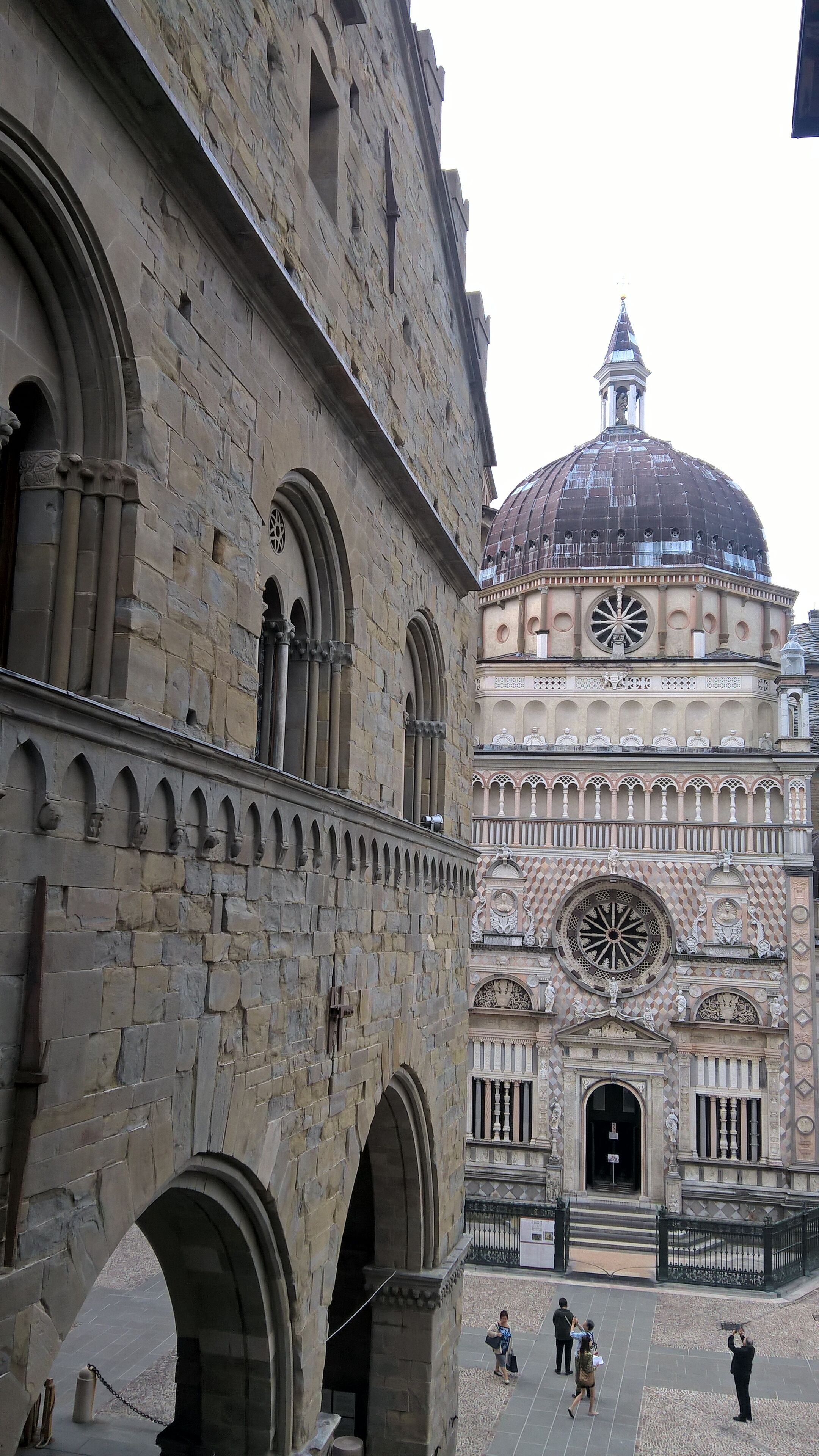 A historic building with a large dome and arched windows.