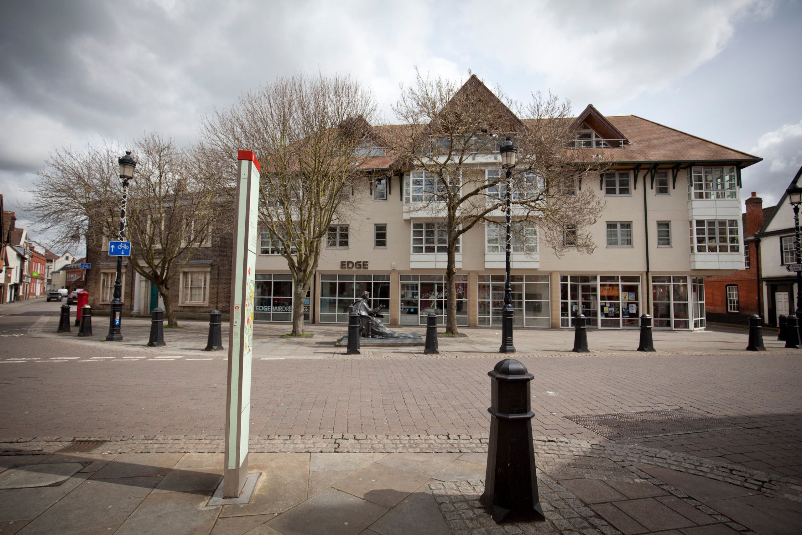 A street with a building labeled "EDGE" and a pedestrian crossing.
