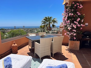 Outdoor dining - Marbella Seaview Escape ☀️ Pools, Fast WiFi & Relaxing Coastal Living (Elviria)