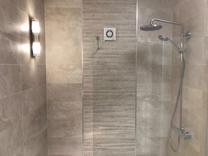 Bathtub, hair dryer, towels, soap