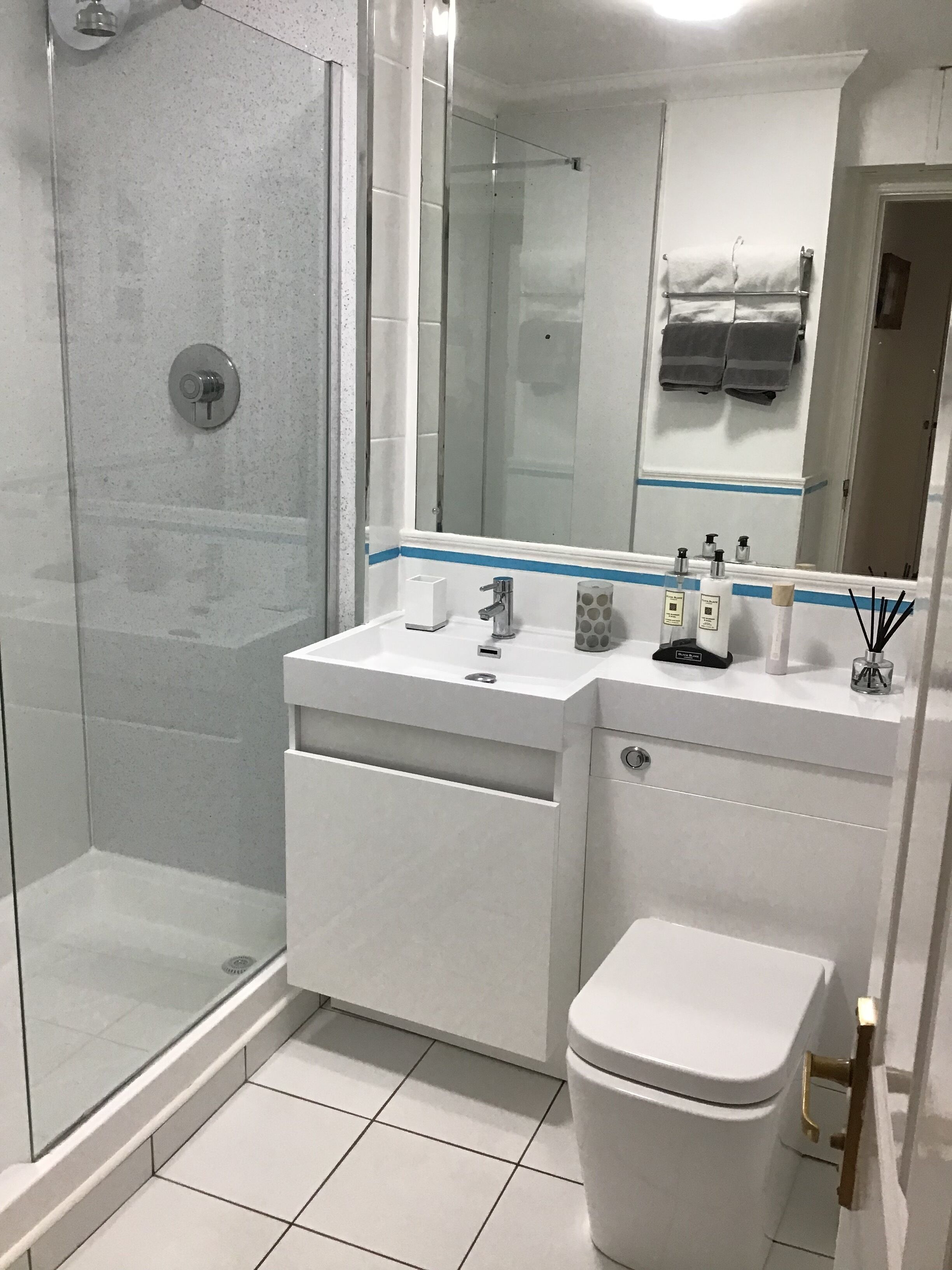 Shower, hair dryer, towels, soap