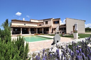 A large house with a swimming pool, outdoor seating, and a well-maintained garden. - Villa SON RUBI in Serra de Tramuntana with BBQ & private pool. It's very popular-Villaonline- - Free Wifi (Selva)