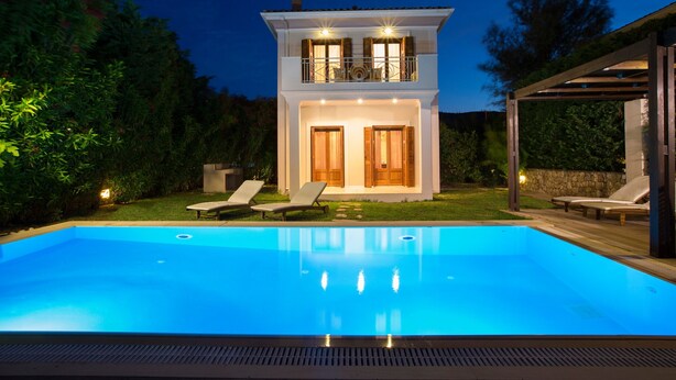 A two-story house with a swimming pool, a covered patio, and a garden. - Aeriko-Ammos Beachfront Villa with Stunning View and Private Pool (LEFKADA)