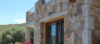 Bouganville apartment on villa with garden facing Tavolara Island