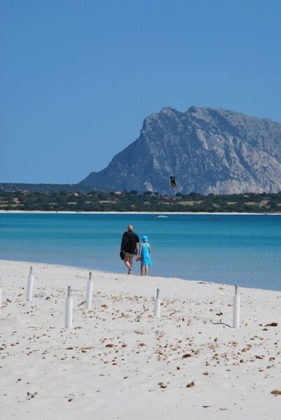 Bouganville apartment on villa with garden facing Tavolara Island