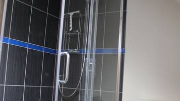 Bathtub, bidet, towels, soap
