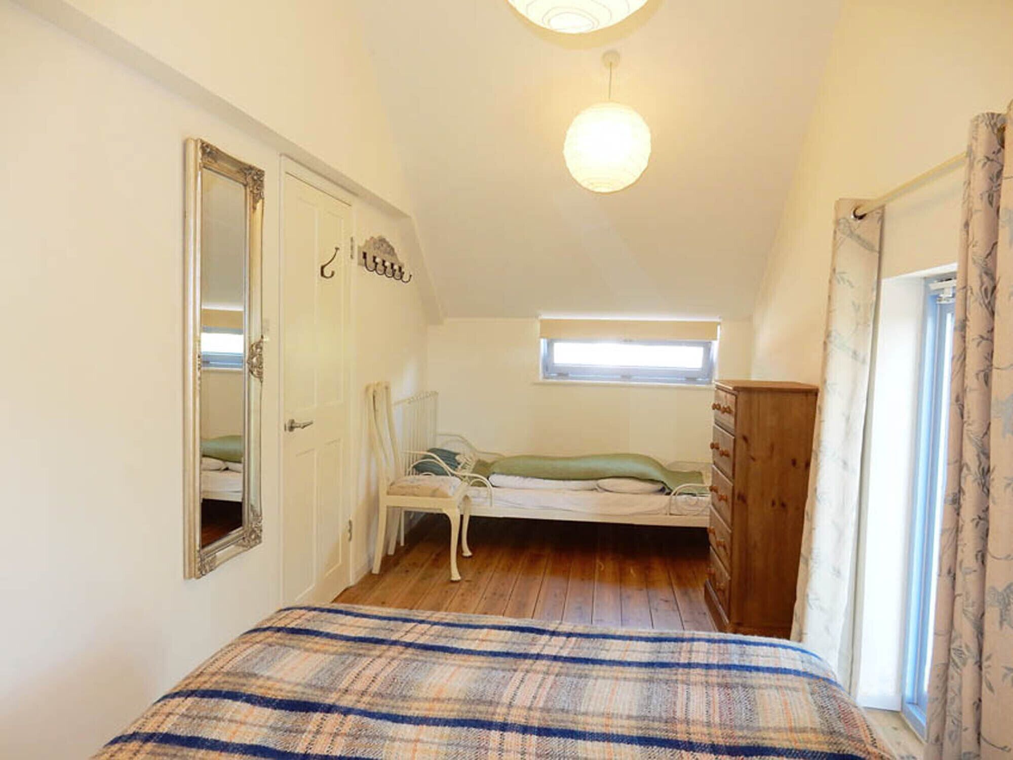Pretty child's bed in first double bedroom.