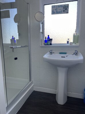 Shower, hair dryer, towels, soap