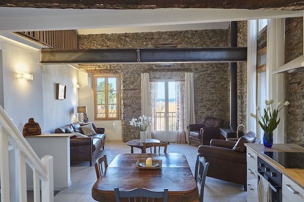 The living room with its view, light & space