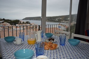 A table set for breakfast with a view of the sea and hills. - INCREDIBLE VIEW (cadaques)