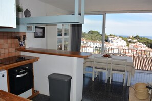 A kitchen with a view of a residential area.