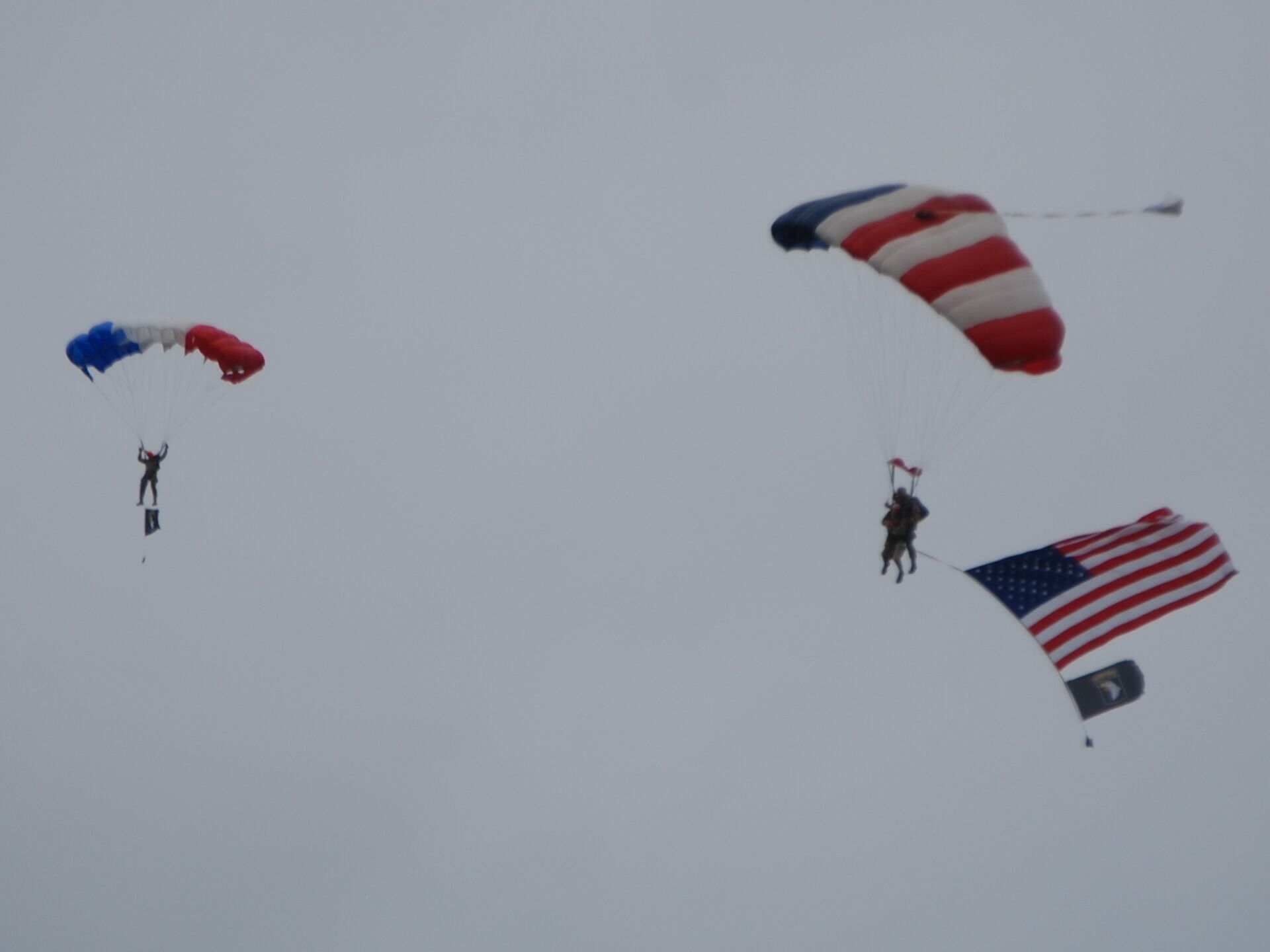 A person skydiving with a parachute.