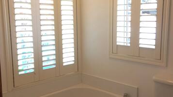 Bathtub, hair dryer, towels, soap