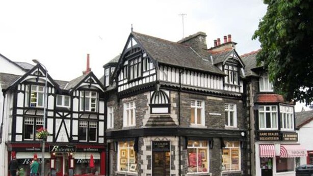 A traditional black and white half-timbered building with a shop on the ground floor. - Windermere house with Lake View, 3 bed 3 bath, dog friendly with ample parking (Bowness-on-Windermere)
