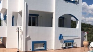 A modern two-story building with balconies, a pool, and outdoor seating. - ☀️Villa Varvara❤️Almyrida⛱️ 350m from Sea❗️No car needed ❗️Samaria Gorge - For Free (Almyrida)