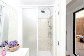 Shower, hair dryer, towels, soap
