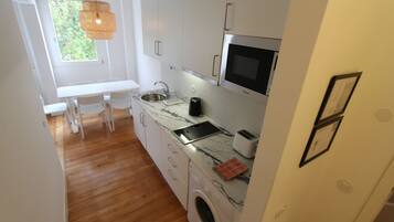 Fridge, microwave, stovetop, coffee/tea maker