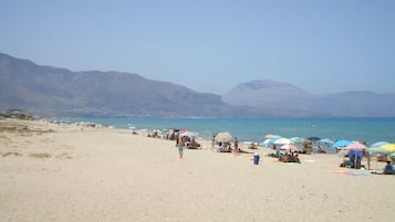 On the beach, sun-loungers, beach towels