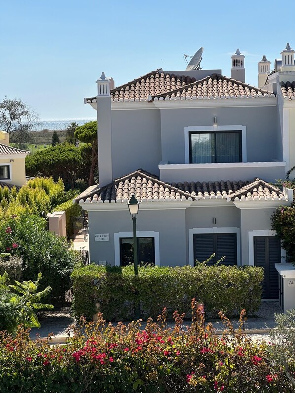 A two-story building with a tiled roof, a satellite dish, and a sign reading "VILLA FOLLY 1238". - Stunning villa in Vale do Lobo, private pool and high speed broadband (Vale do Lobo)