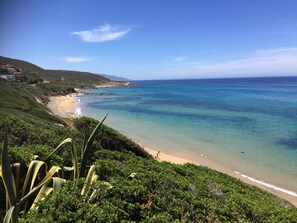 Enjoy a serene beach experience with breathtaking ocean views and lush surroundings.