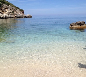 On the beach, sun loungers, beach towels
