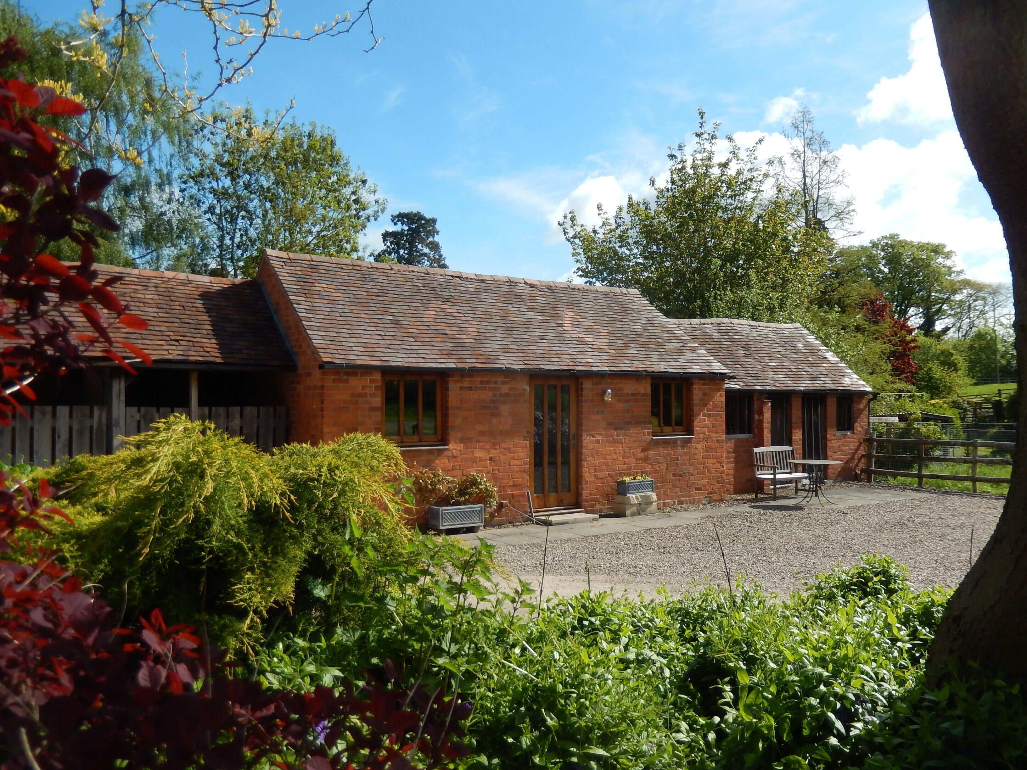 Sunny Cottage over-looking part of a Large Garden, in rural surroundings.