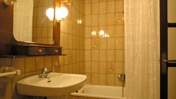 Bathtub, hair dryer, bidet, towels