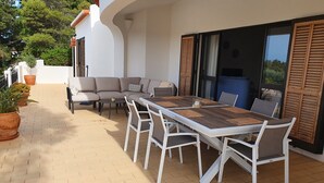 A patio with a dining table, chairs, and a sofa. - Spacious luxury villa with A/C near beach with private pool (Carvoeiro)