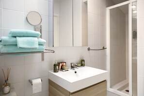 Shower, hair dryer, towels, soap