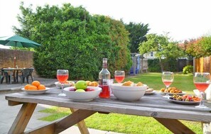 Enjoy a meal al fresco in our garden patio surrounded by lush greenery.