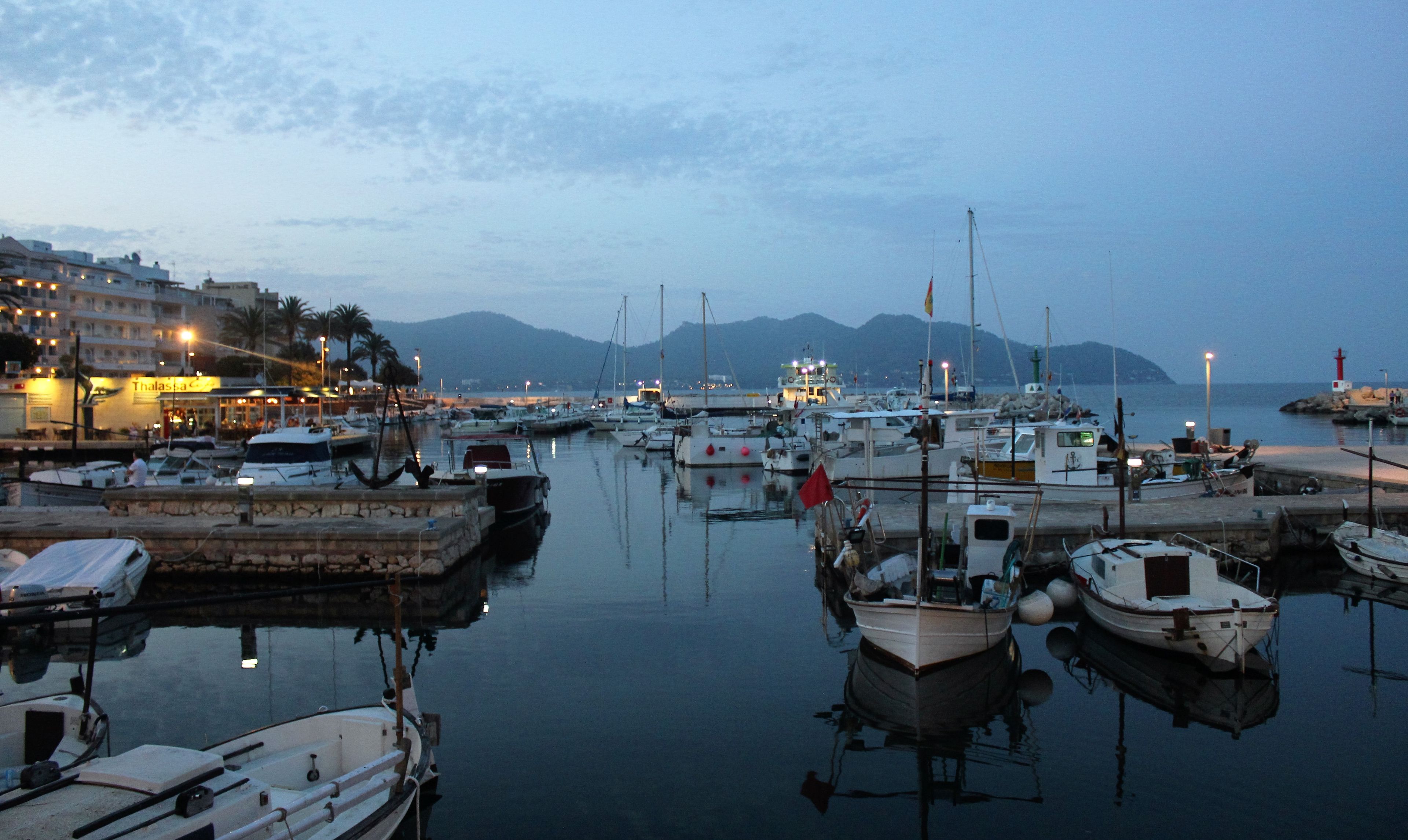 A marina with boats docked at the Cala Bona Harbour.