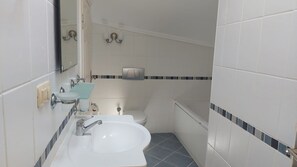 Combined shower/tub, hair dryer, towels, soap