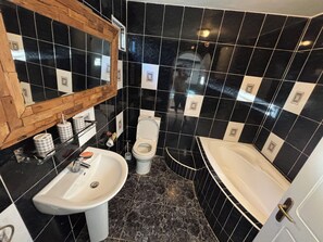 Bathtub, hair dryer, towels