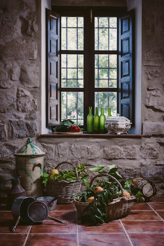 Typical Andalusian farmhouse surrounded by olive and fruit trees