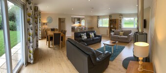 Luxury Contemporary Wooden Lodge Set In Rural Landscape With Garden And Parking