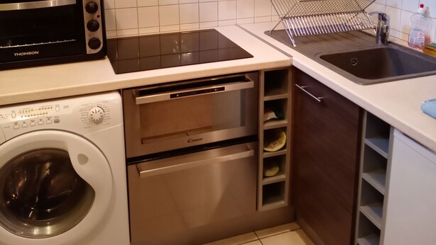 A compact kitchen with a microwave, toaster, oven, and sink. - rent pretty calm and pleasant studio (Bagnoles De L'orne Normandie)