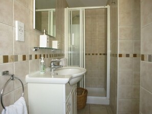 Shower, hair dryer, towels, toilet paper