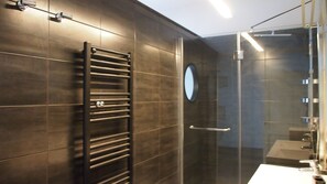 Bathtub, hair dryer, towels, soap
