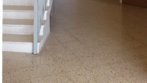 A staircase with white steps and a metal railing, leading to a landing with a wooden bench. - Apartment with Sea View (Flat 5) (Triq L-Gherien, Mellieha)