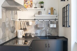 Fridge, microwave, stovetop, coffee/tea maker