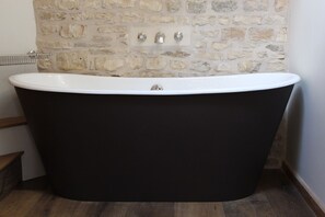 Bathtub, hair dryer, towels