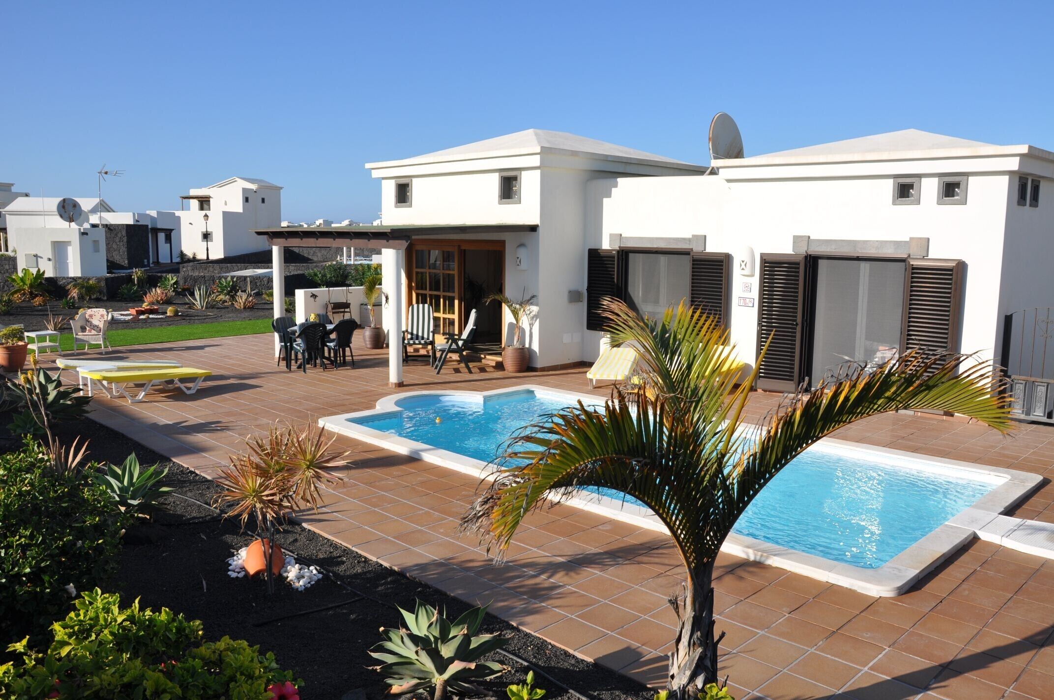 A heated pool, pool loungers