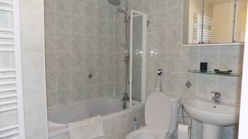 Combined shower/bathtub, hair dryer, towels, soap