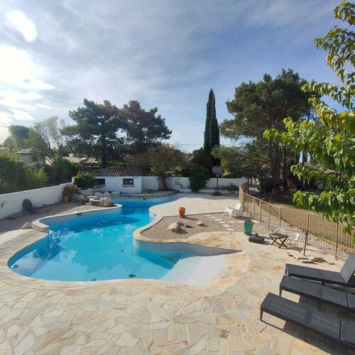 Cottage with private garden in wooded property with swimming pool