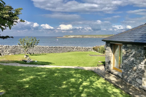 view of house and sea with Jerry the fisherman bringing back daily fresh fish