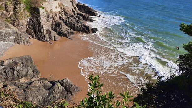 A coastal landscape with a historic building and a fort on a rocky outcrop. - Architect Designed Stunning House, In Quiet And Peaceful Stunning Location  (Tenby. Pembrokeshire)